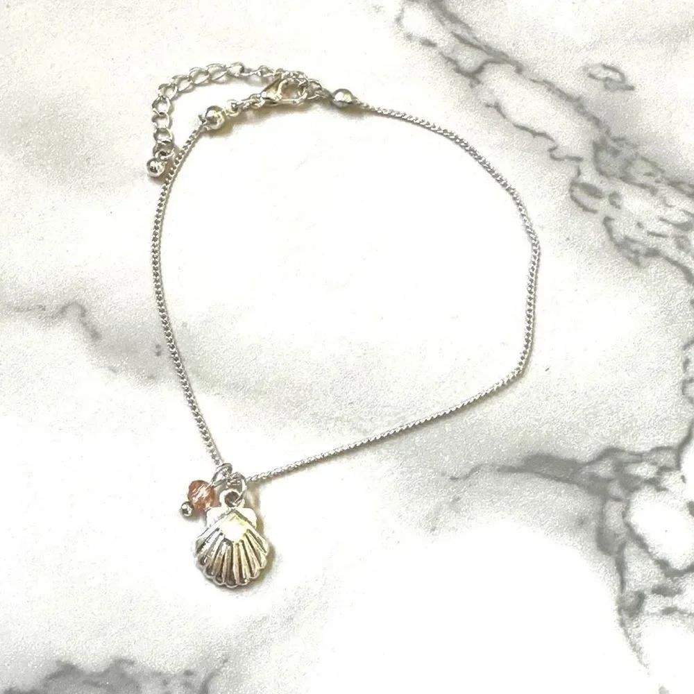 Silver tone shell charm bracelet - Picture 2 of 5